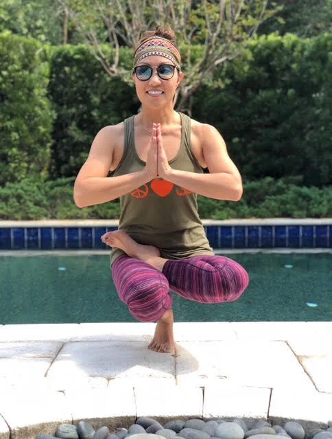 Dr. Jean Chang-Lowe practicing yoga outdoors